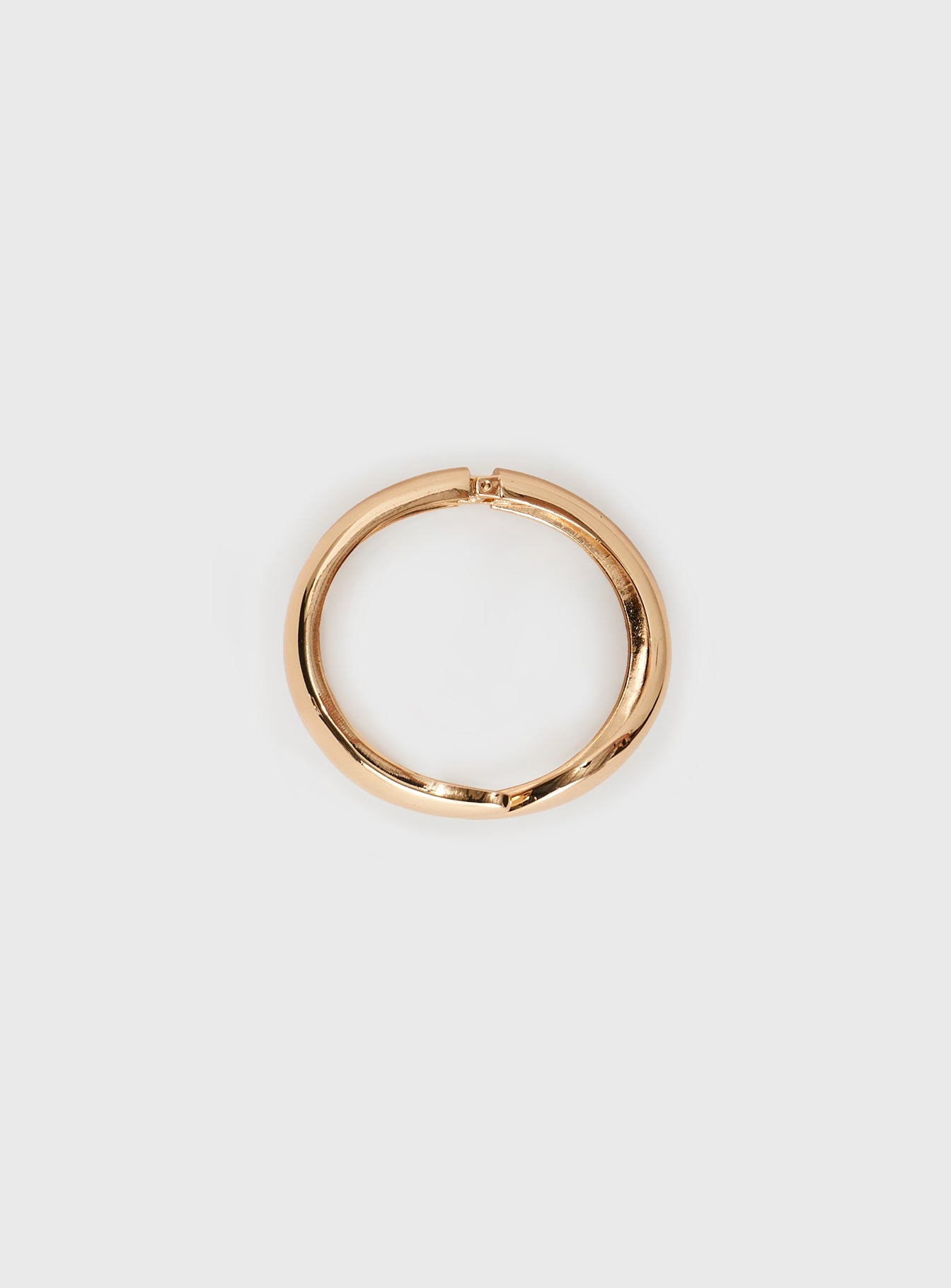 Gold-toned cuff, hinged opening