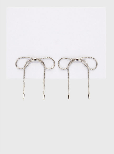 Silver-toned earrings Bow design, stud fastening