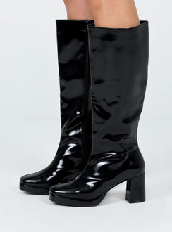 Knee high boots Princess Polly Exclusive Upper: 100% PU Lining: 100% fabric Outsole: 100% rubber Faux glossy leather  Zip fastening at side  Block heel  Rounded toe 