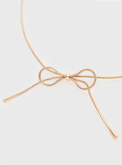Gold-toned necklace Bow detail, lobster clasp fastening