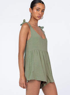 Romper loose fitting Linen look material Tie shoulder straps Wide neckline Gathered waist Twin hip pockets