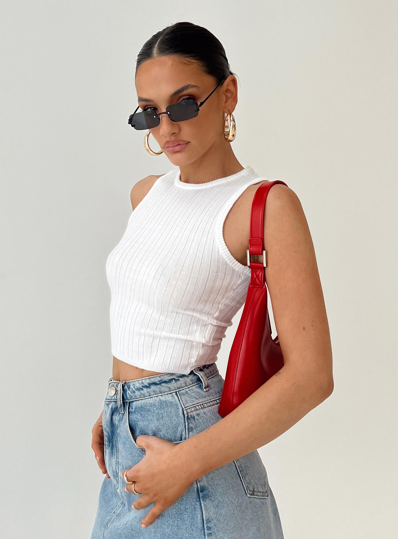 Front view of model wearing  front Princess Polly Sleeveless High Neck  Cassa Tank Top Ivory