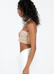 Strapless top Twist front detail Gathered bust Inner silicone strip at bust Shirred back Zip fastening at back Stretch at back Partially lined  