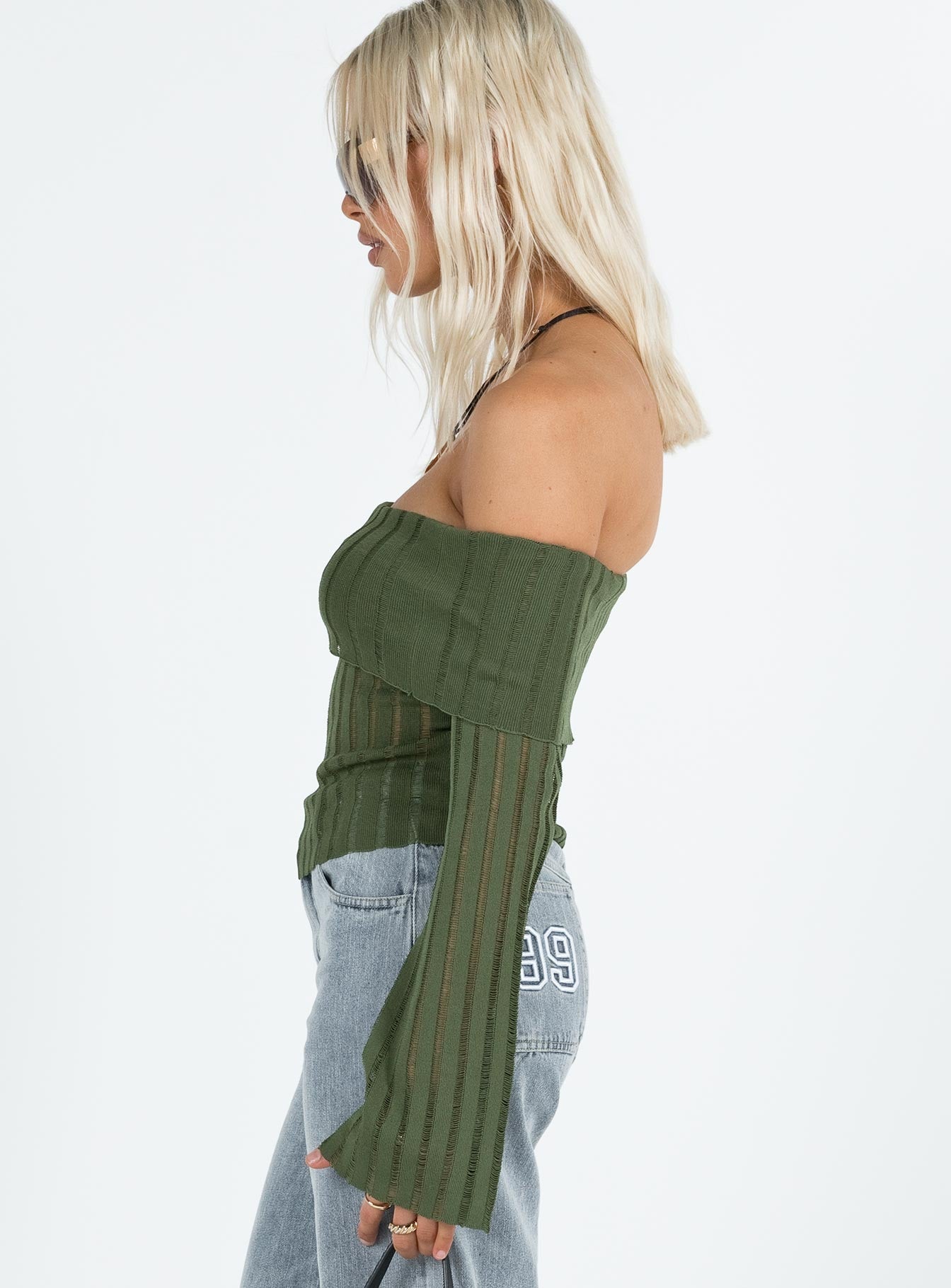 Green off the shoulder top Knit material Folded neckline Inner silicone strip at bust Flared sleeves