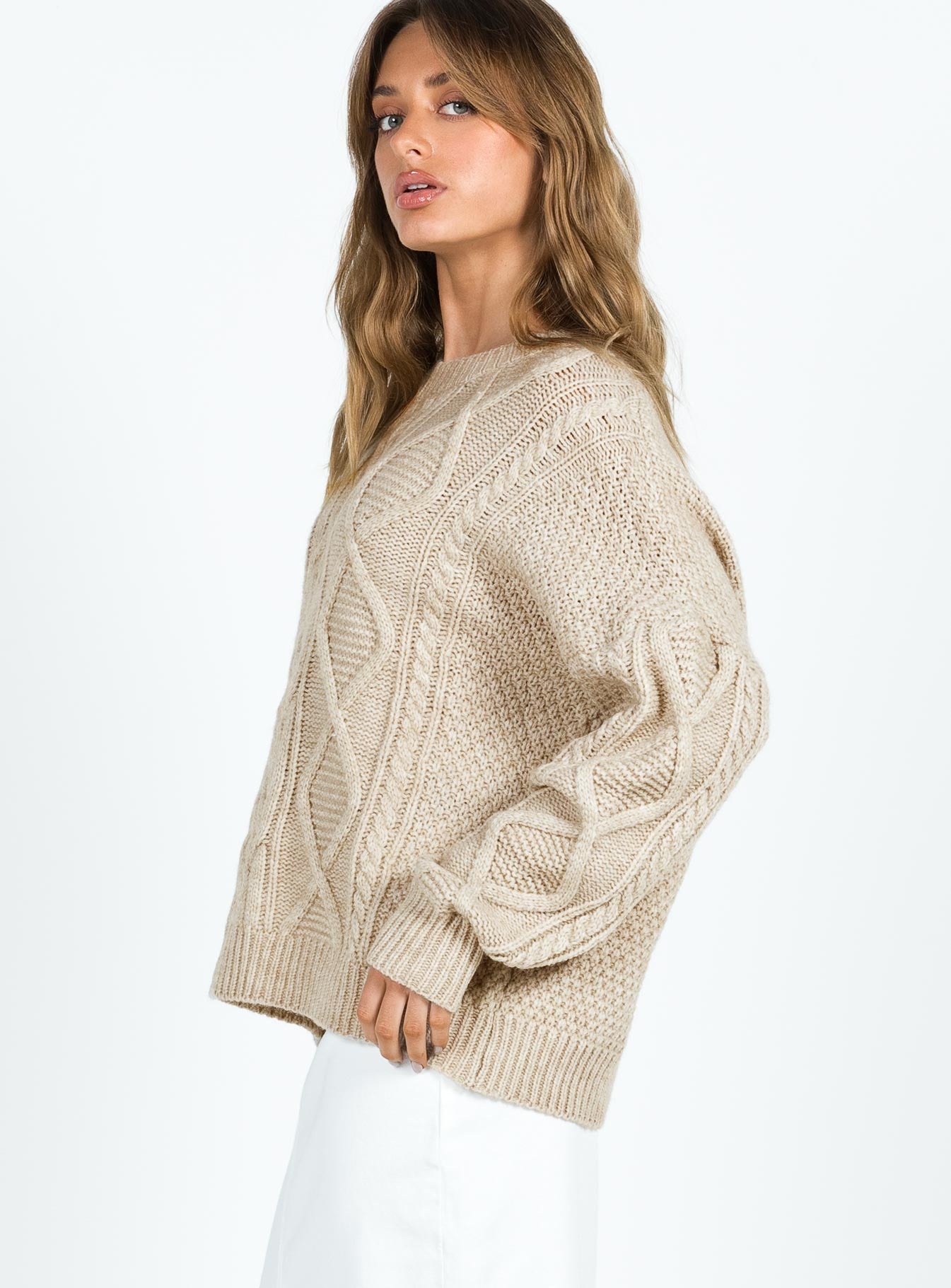side view of model wearing Princess Polly Canlish Cable Sweater Latte Long 