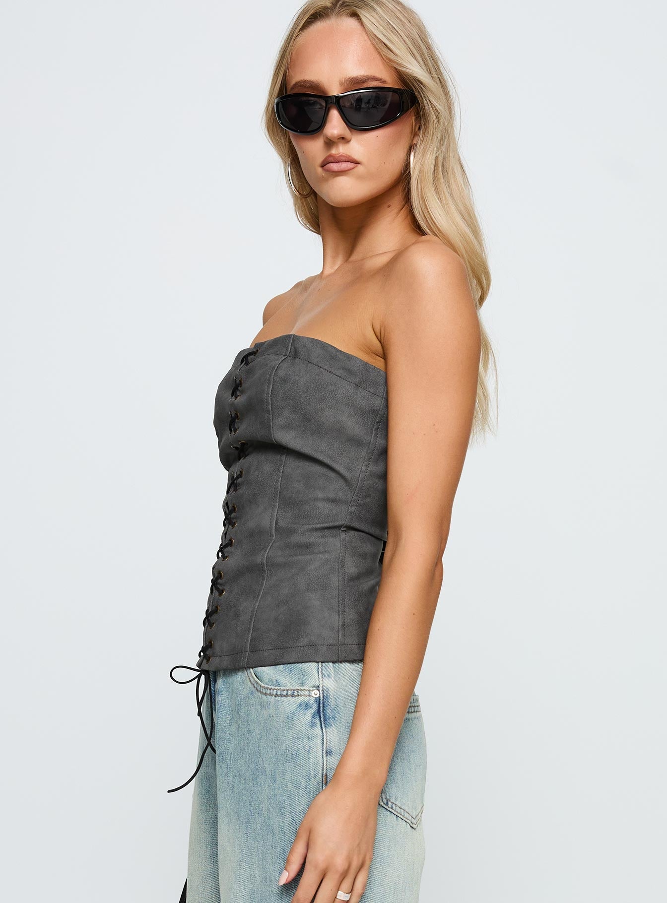 side view of model wearing Princess Polly Soft Spoken Strapless Tie Up Top Black Sleeveless straight 