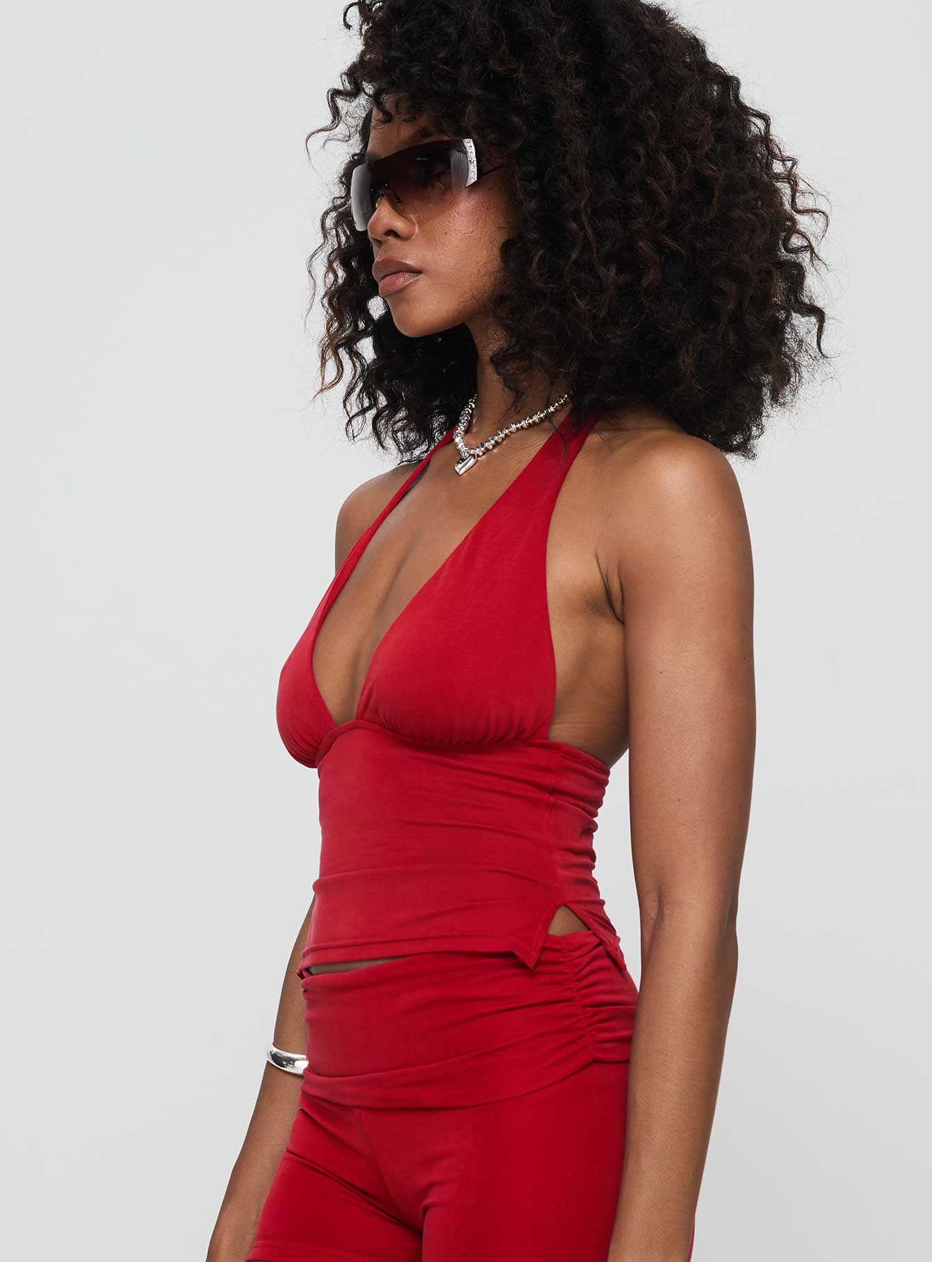 side view of model wearing Princess Polly Take Me Out Halter Top Red Sleeveless Plunger 