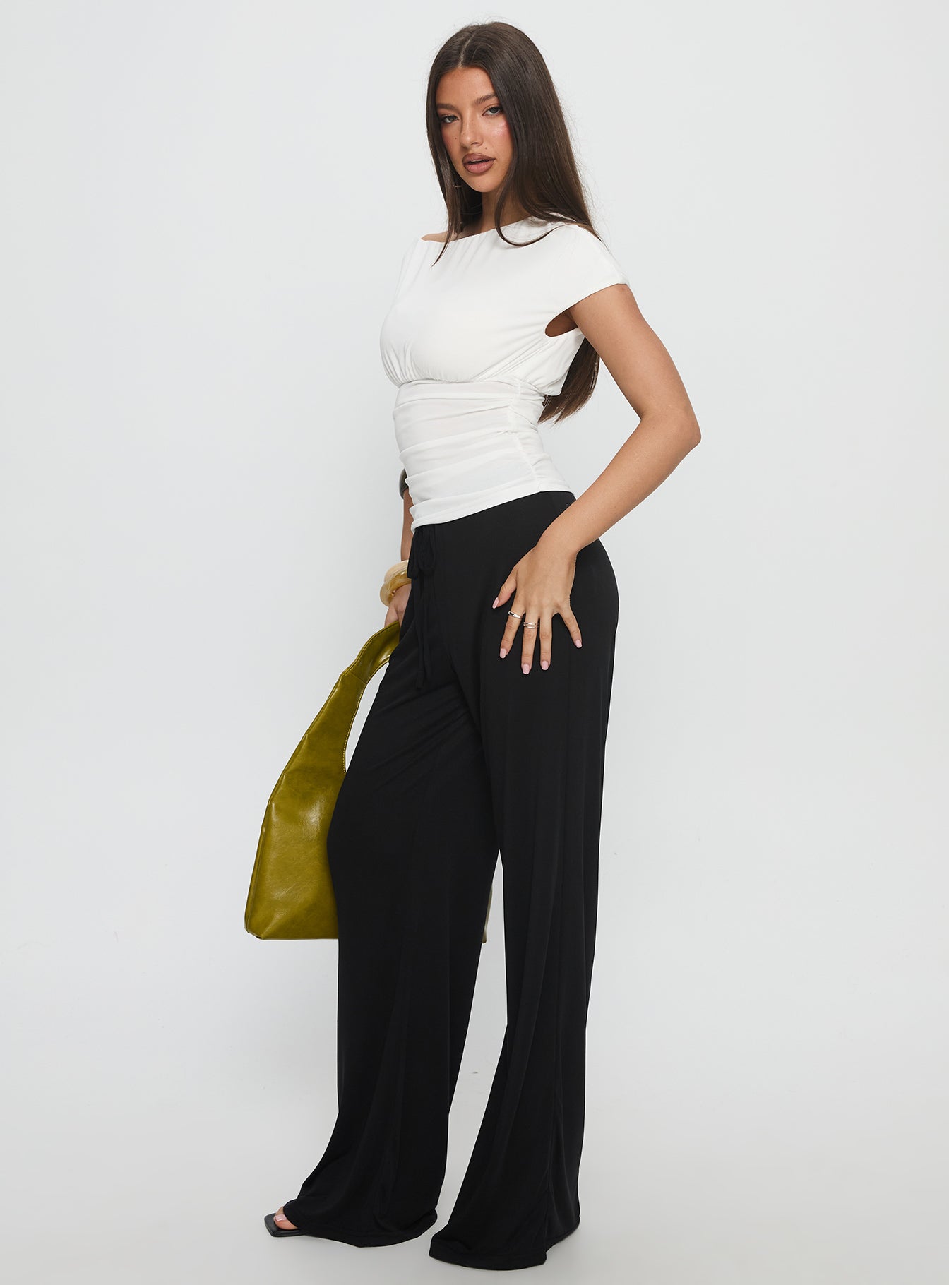 side view of model wearing Princess Polly Gavrielle Jersey Wide Leg Pants Black High Rise Pants 