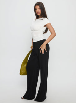 side view of model wearing Princess Polly Gavrielle Jersey Wide Leg Pants Black High Rise Pants 