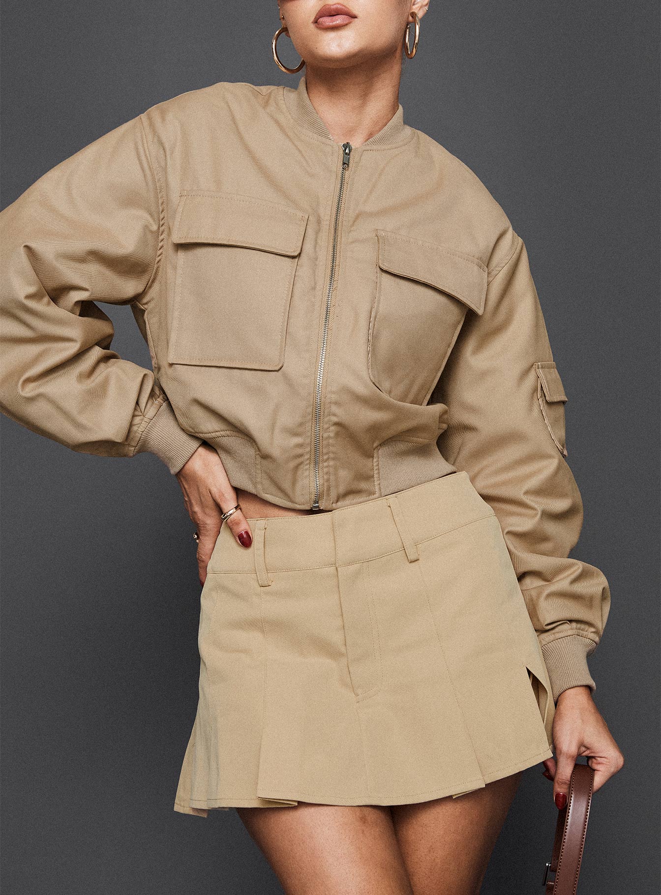 front view of model wearing Princess Polly Calianna Pleated Mini Skort Camel High Waisted Shorts 