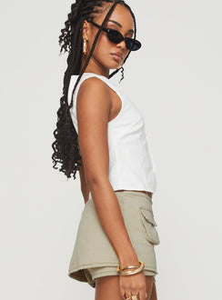 side view of model wearing Princess Polly Aguilera Top White Sleeveless Crew Neck 