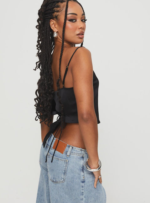 side view of model wearing Princess Polly Olivette Top Black Sleeveless Scoop Neck 