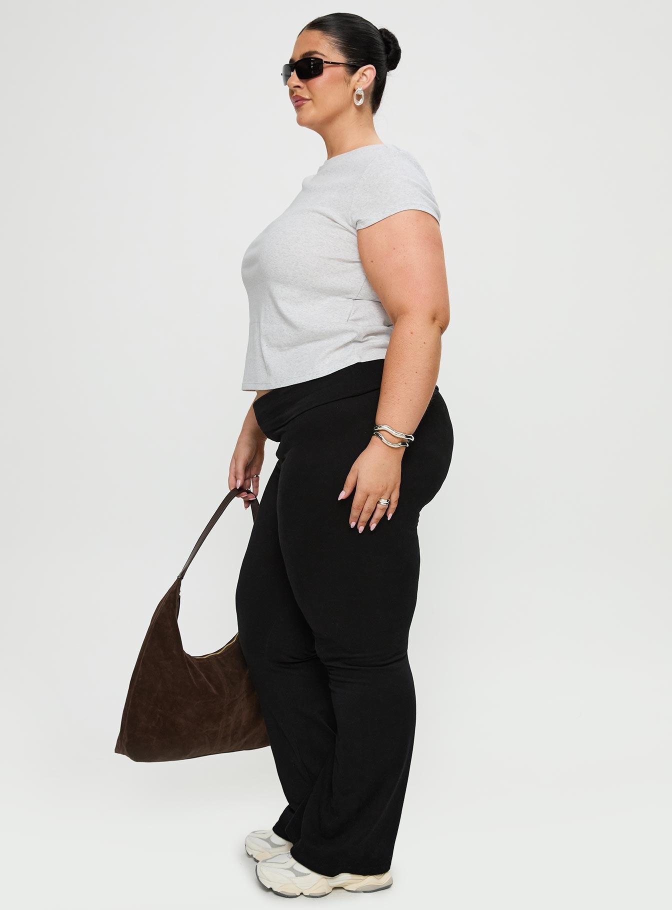 side view of model wearing Princess Polly Movement Yoga Pant Black Curve High Waisted Pants 