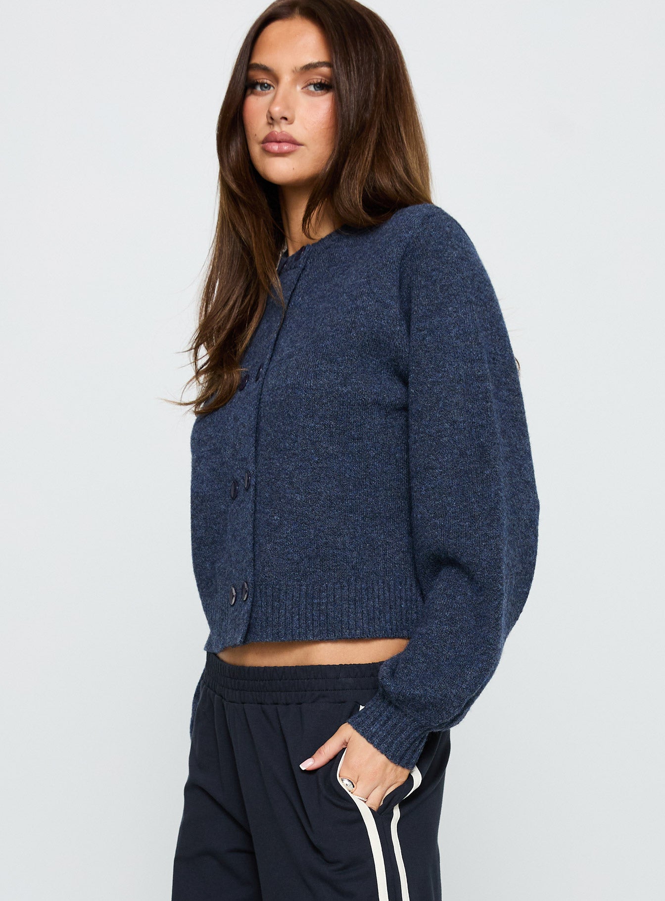 side view of model wearing Princess Polly Kammi Button Up Cardigan Navy Cropped 