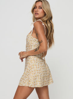 side view of model wearing Princess Polly Landon Mini Dress Yellow Floral Petite Scoop Neck 