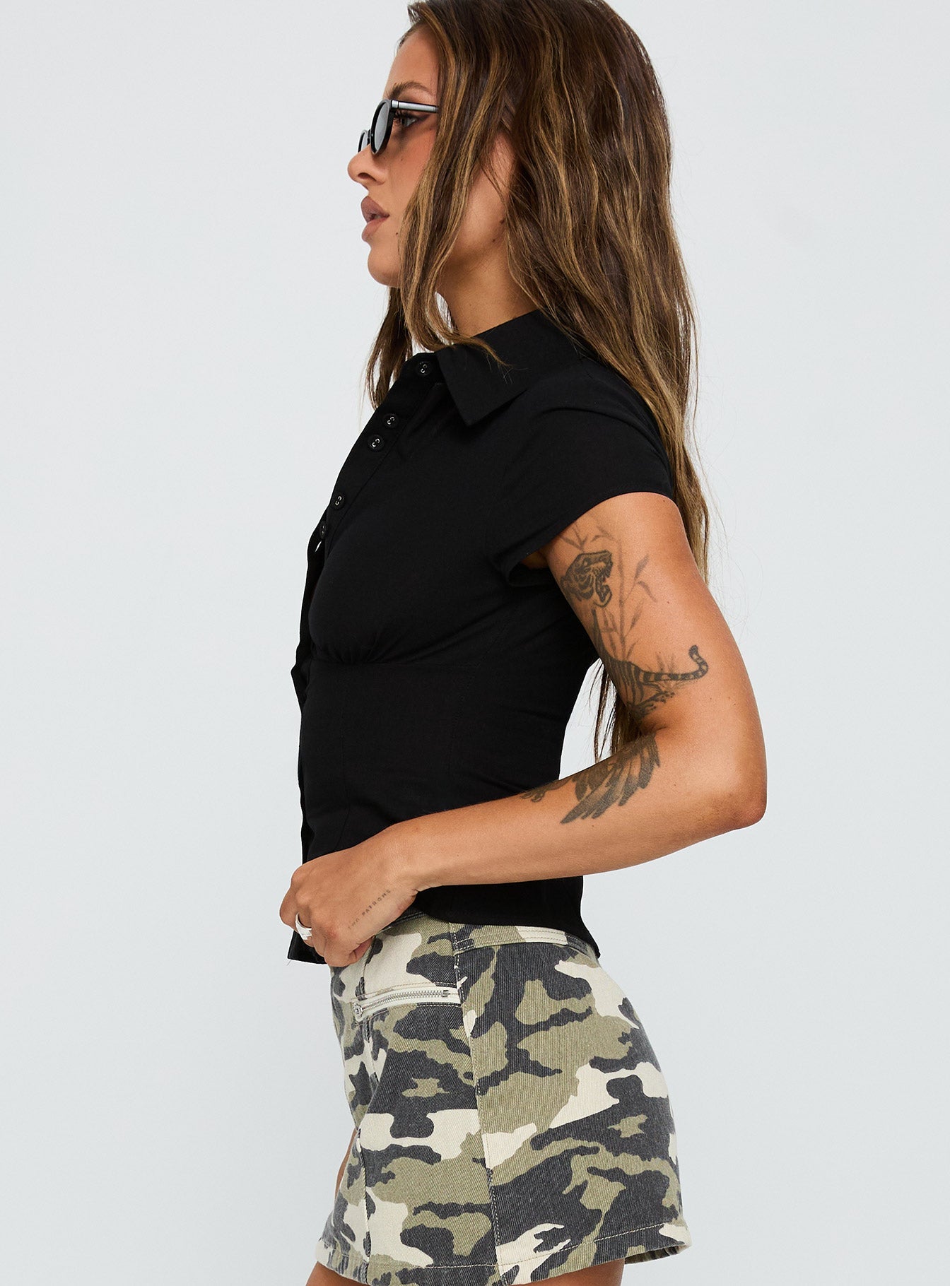 back view of model wearing Princess Polly Cottesloe Blouse Top Textured Black Short Sleeves V-Neck 