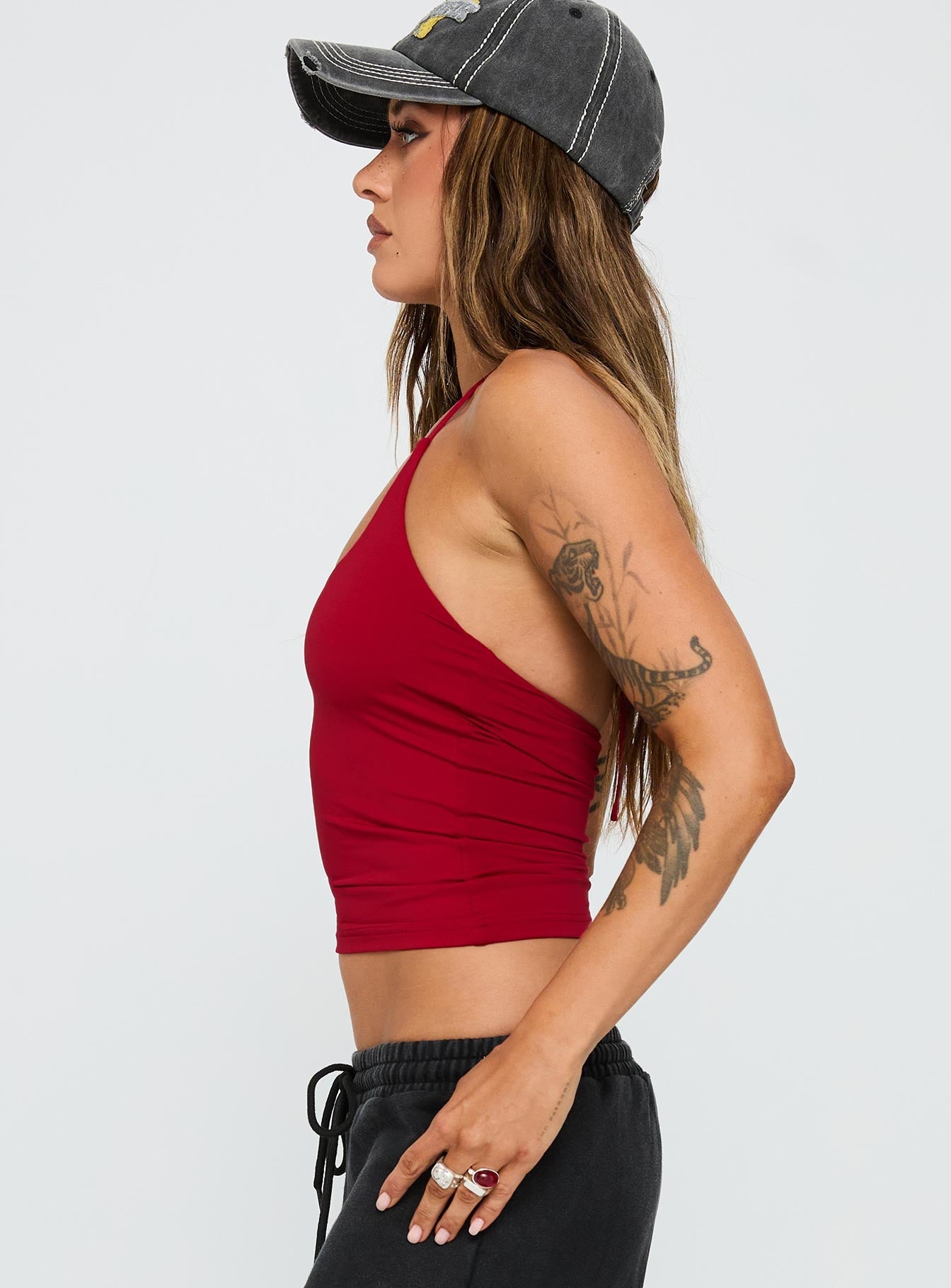 side view of model wearing Princess Polly Ezekiel Nylon Top Red Sleeveless Scoop Neck 