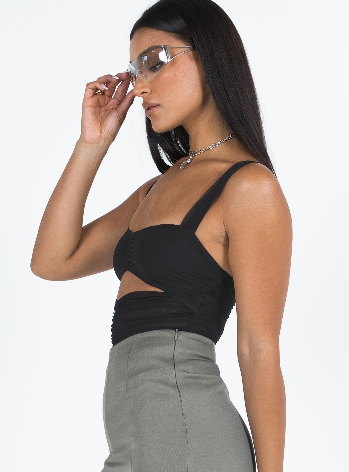 side view of model wearing Princess Polly Kalmia Bodysuit Black Sleeveless 