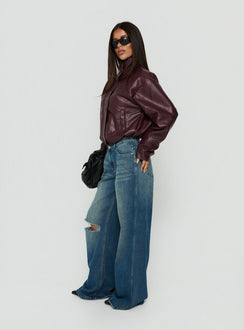 Discover the Ramos Low Rise Wide Leg Distressed Jeans Dark Indigo womens-jeans side view of model wearing Princess Polly