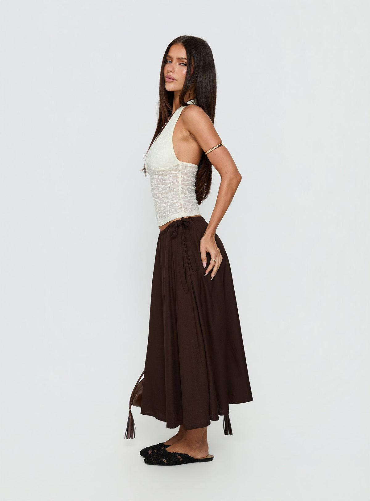   side view of model wearing Princess Polly Persuasion Tie Side Midi Skirt Chocolate Midi Skirts Skirts 