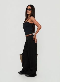 Crafted from the Lockie Foldover Baggy Track Pants Black womens-regular-pants with high-rise side view of model wearing