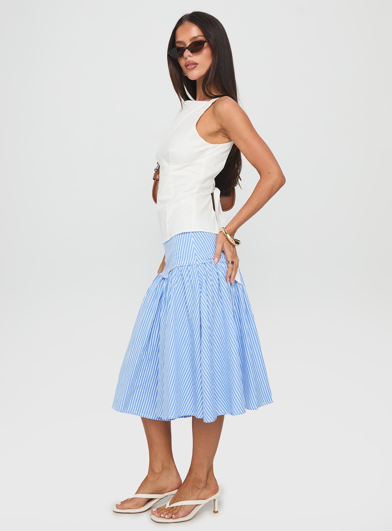   side view of model wearing Princess Polly Raelan Tiered Midi Skirt Blue Stripe Midi Skirts 