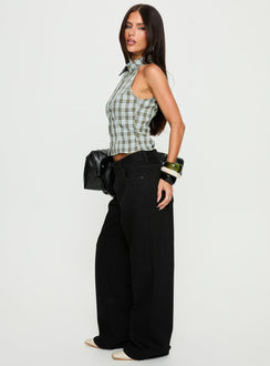 side view of model wearing Princess Polly Serenitia Mid Rise Relaxed Jeans Jet Black Mid Rise Jeans 