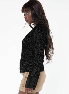 Long sleeve top, v-neckline Button fastening at front, split hem, lace trim