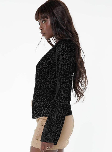 Long sleeve top, v-neckline Button fastening at front, split hem, lace trim