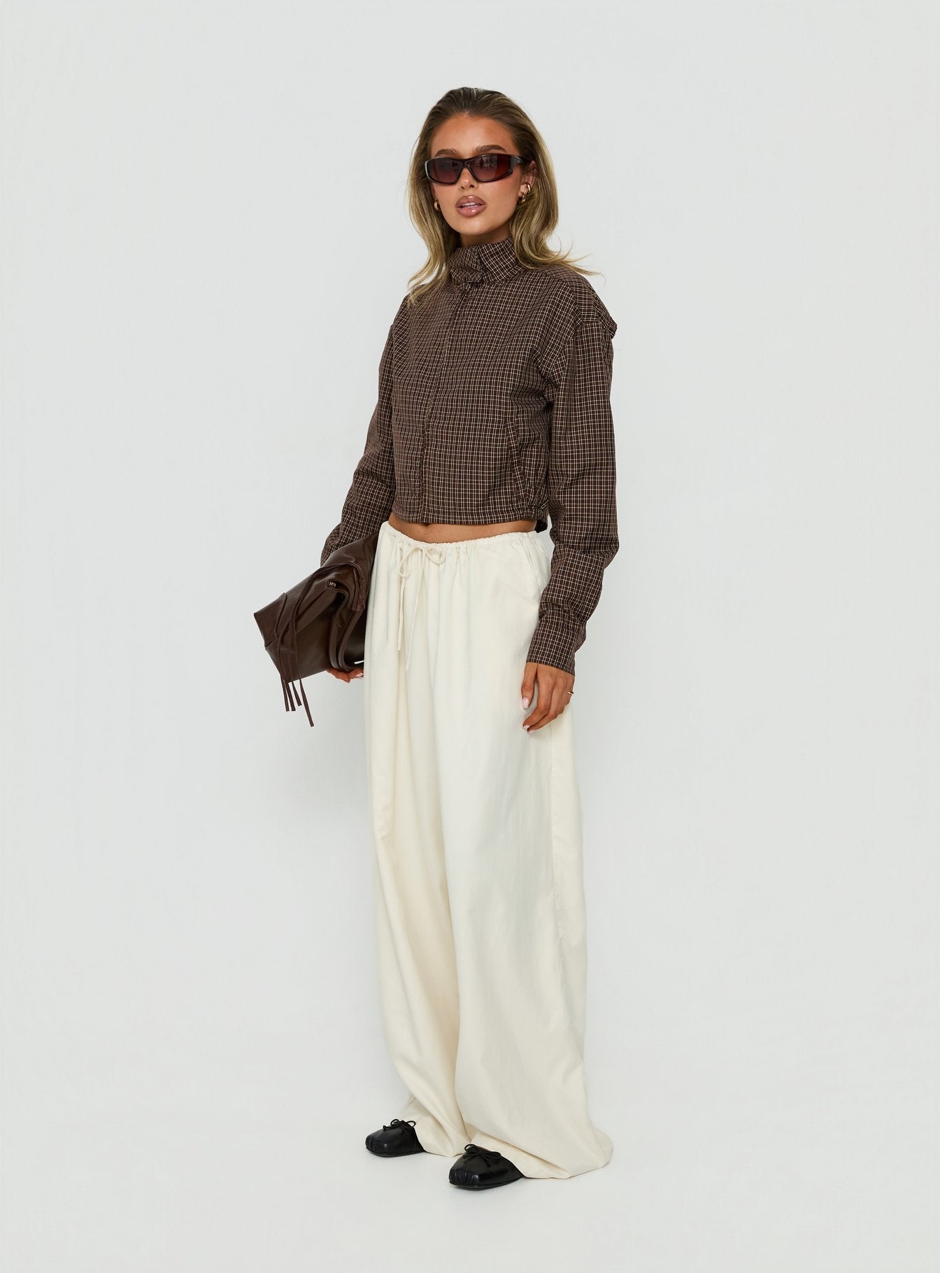 Featuring the Bungala Oversized Relaxed Pants Ivory womens-regular-pants with high-rise wide-leg cut side view of model wearing Princess Polly