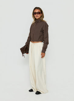Featuring the Bungala Oversized Relaxed Pants Ivory womens-regular-pants with high-rise wide-leg cut side view of model wearing Princess Polly