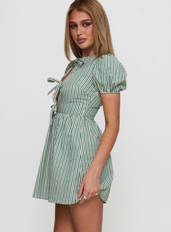 side view of model wearing Princess Polly Nurture Bow Mini Dress Green Stripe Crew Neck 