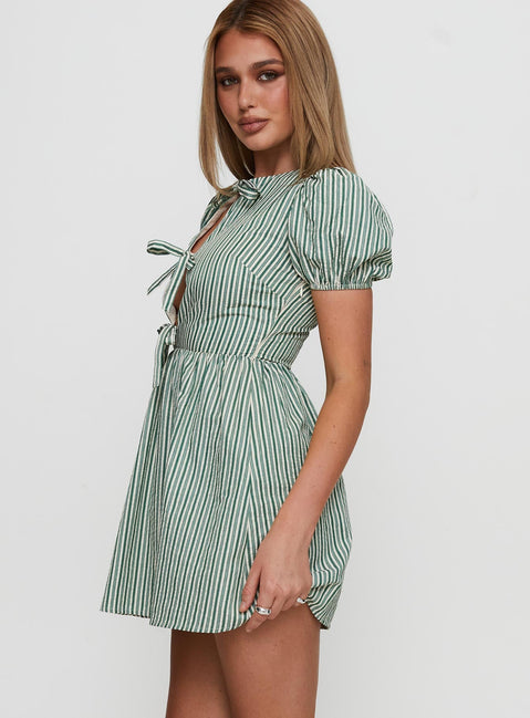 side view of model wearing Princess Polly Nurture Bow Mini Dress Green Stripe Crew Neck 