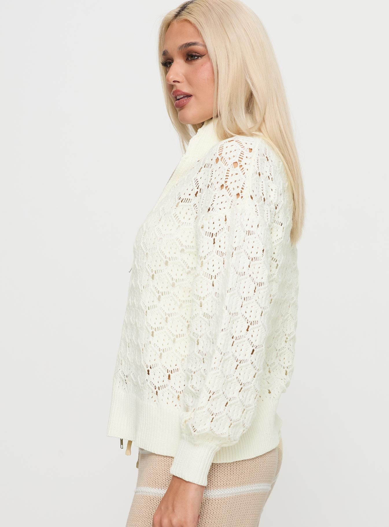 side view of model wearing Princess Polly Sirena Zip Through Knit Sweater Cream 