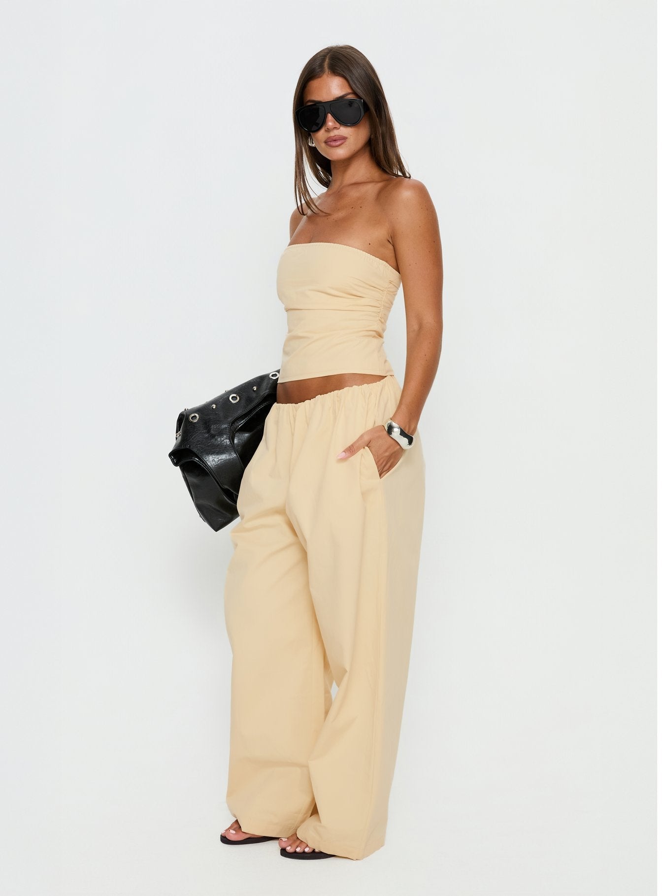 side view of model wearing Princess Polly Tidekiss Pants Lemontini Mid Rise Pants 