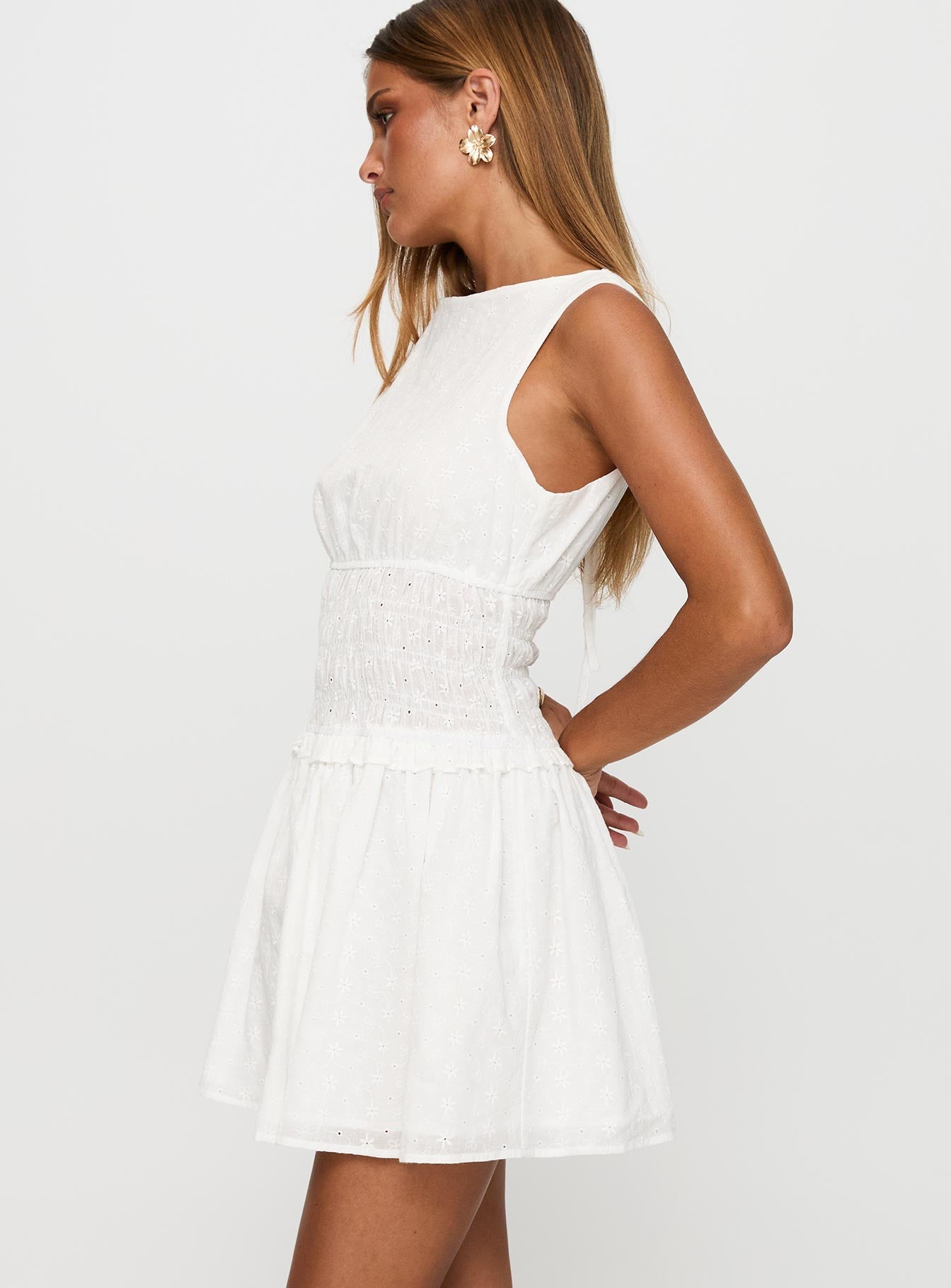 side view of model wearing Princess Polly Yennifer Shirred Broiderie Mini Dress White Crew Neck 