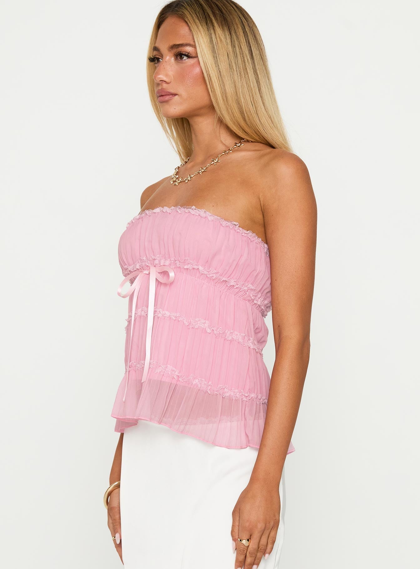 side view of model wearing Princess Polly Avelina Strapless Top Pink Sleeveless straight 