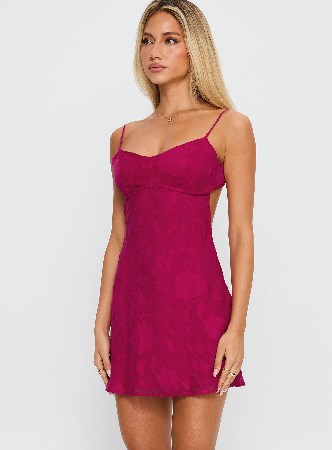 side view of model wearing Princess Polly Clemence Mini Dress Hot Pink Sweetheart Neckline 