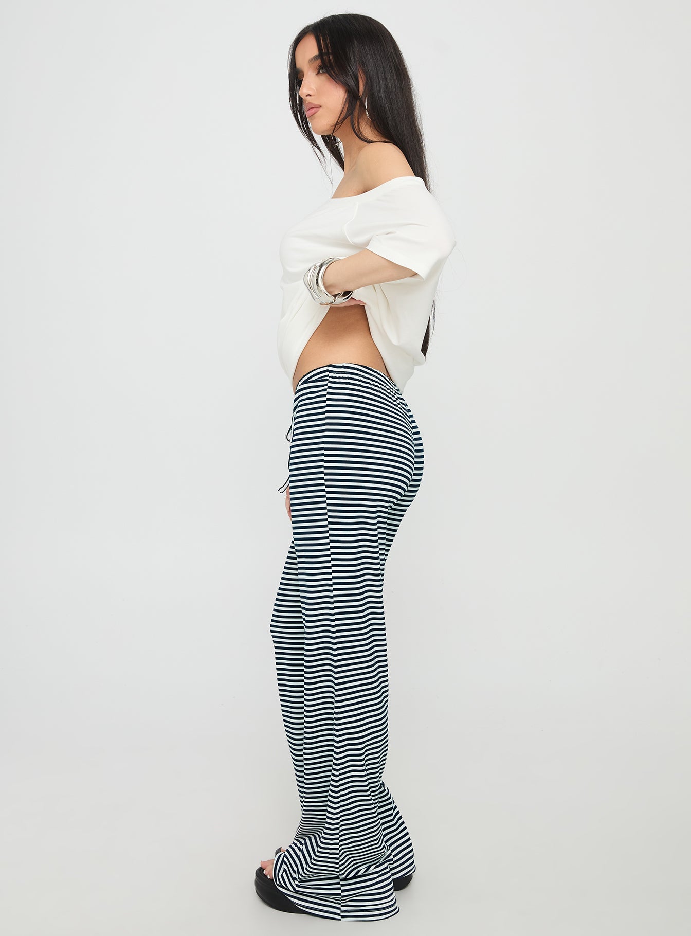 side view of model wearing Princess Polly Alfreda Jersey Pant Navy Stripe High Waisted Pants 