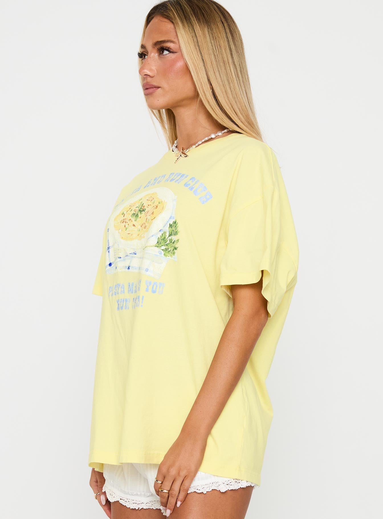 side view of model wearing Princess Polly Pasta Makes You Fasta Oversized Tee Yellow Half Sleeves Crew Neck 