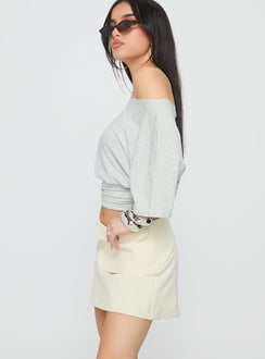   side view of model wearing Princess Polly Supersonic Belted Denim Mini Skirt Ivory Mini Skirts Skirts 