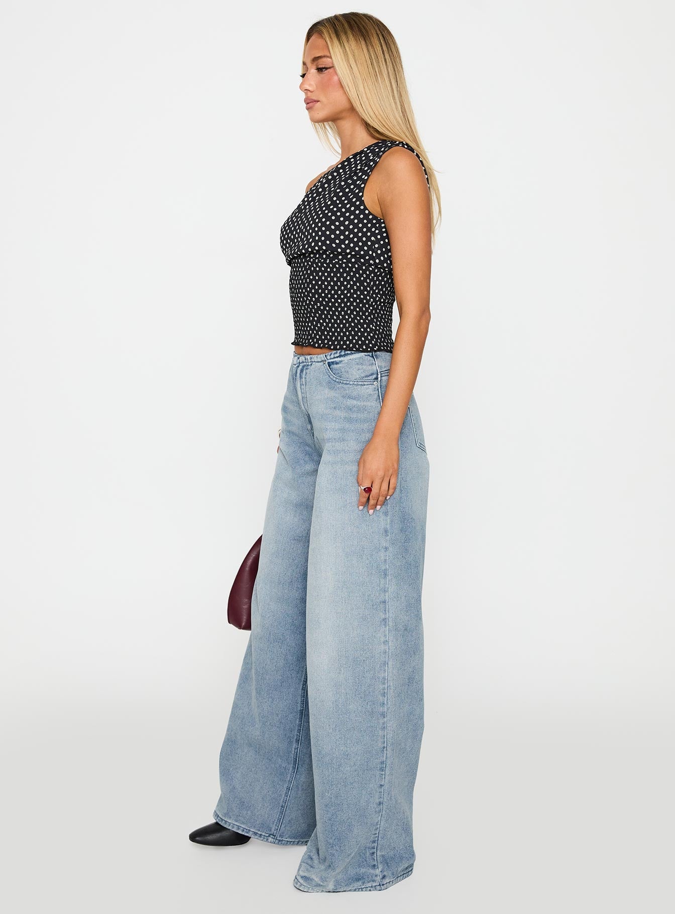 side view of model wearing Princess Polly Bowe Wide Leg Jeans Blue High Waisted 