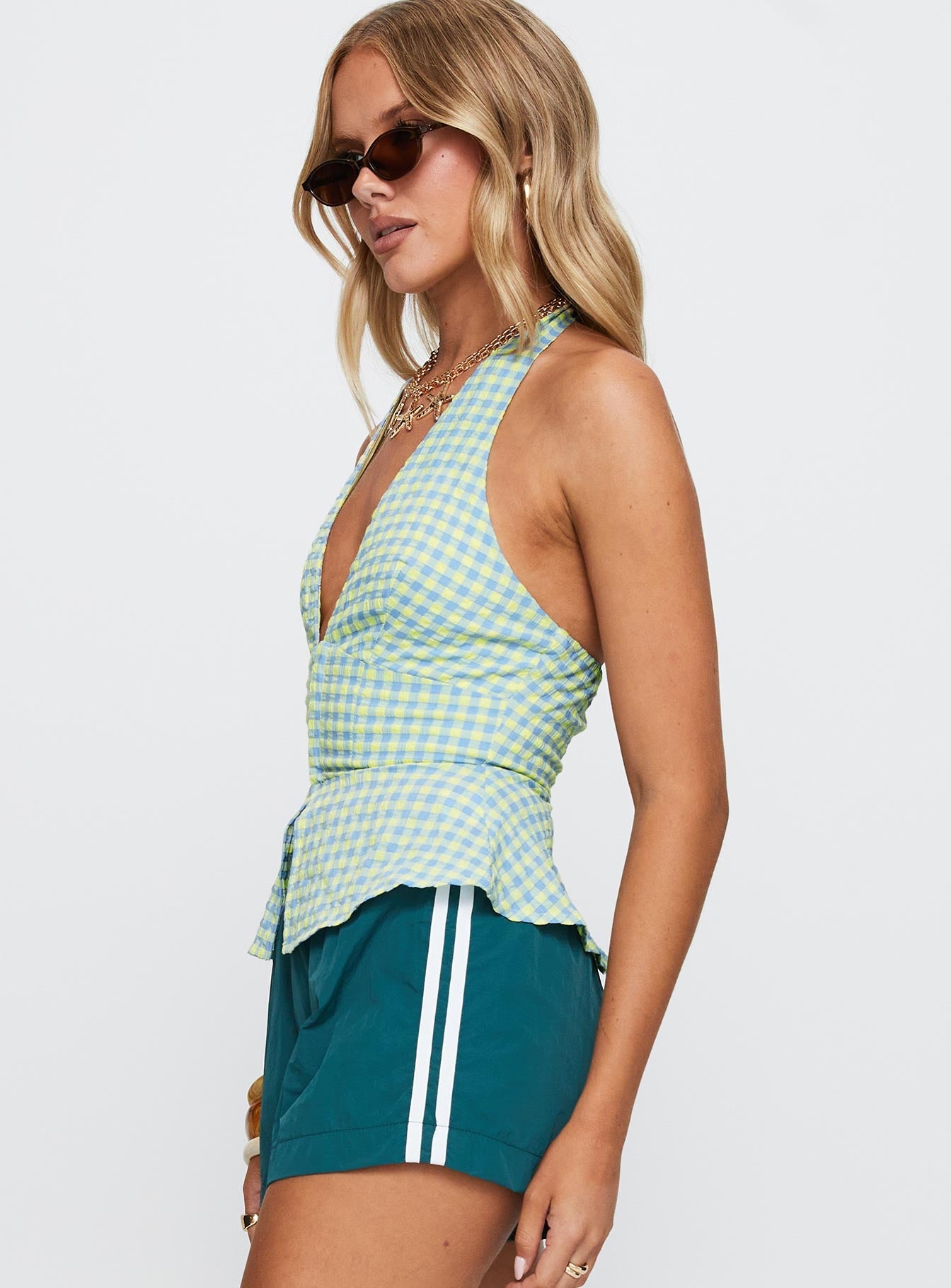 side view of model wearing Princess Polly Becci Halter Top Multi Sleeveless Plunger 