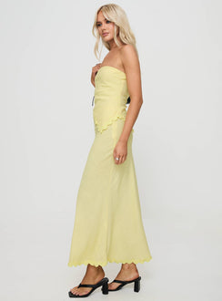   side view of model wearing Princess Polly Silvershore Maxi Skirt Yellow Maxi 