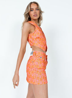   side view of model wearing Princess Polly The Ragged Priest Doll Mini Skirt Orange Mini Skirts 