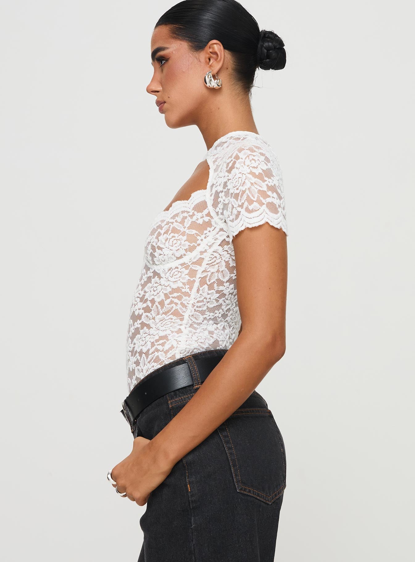 side view of model wearing Princess Polly Giallo Bodysuit White Short Sleeve 