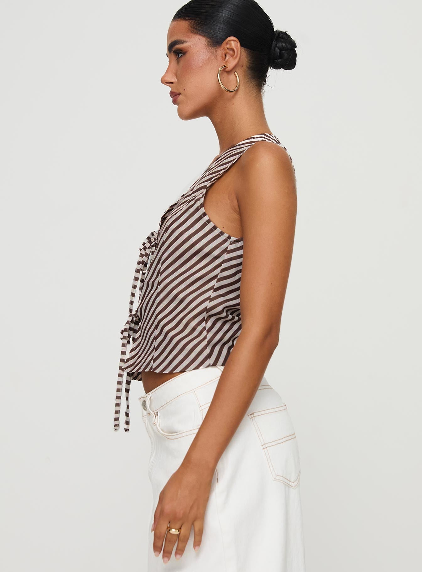 side view of model wearing Princess Polly Lishar Top Brown Stripe Sleeveless V-Neck 