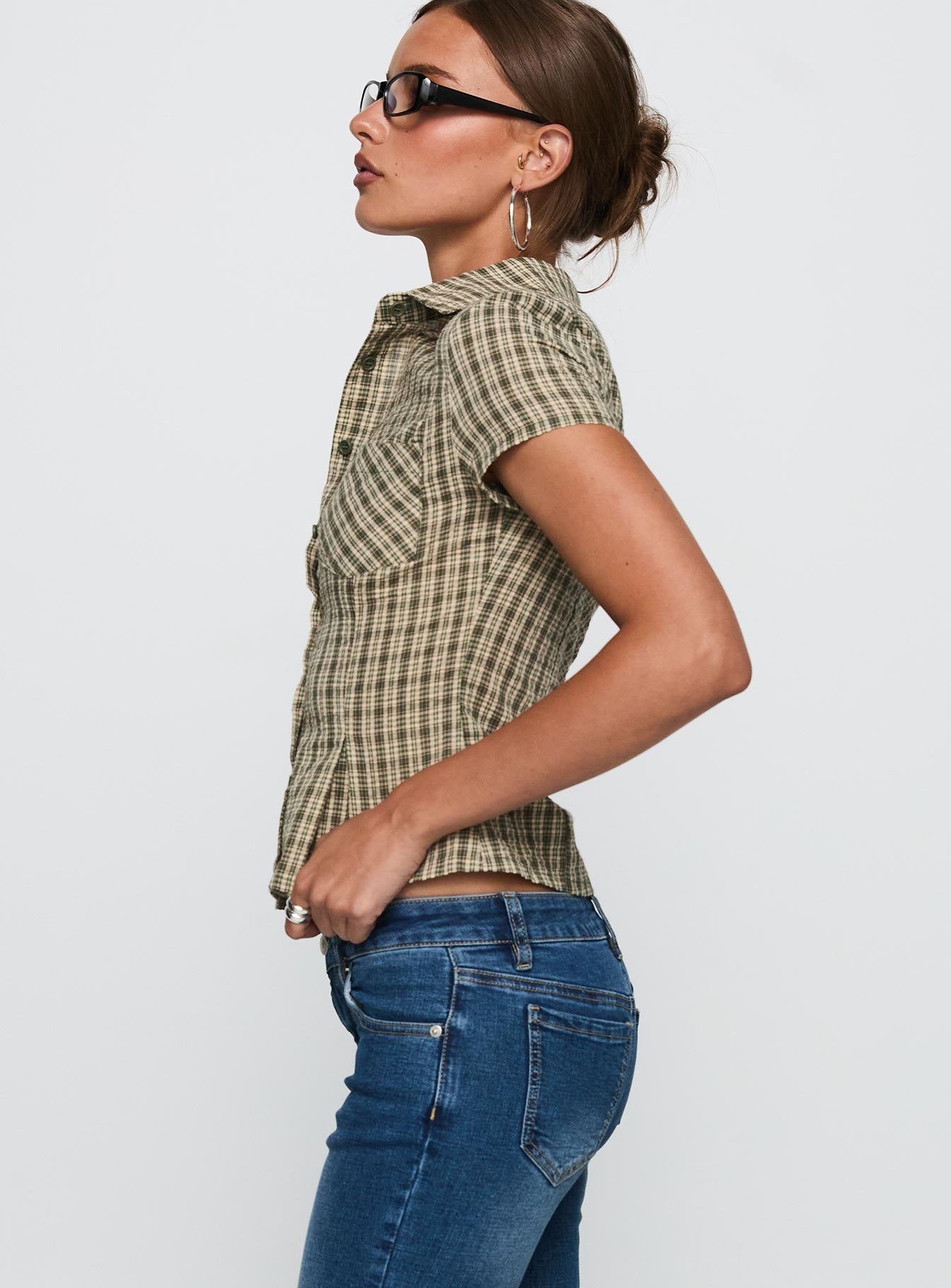 side view of model wearing Princess Polly Alma Mater Top Green Check Short Sleeves V-Neck 