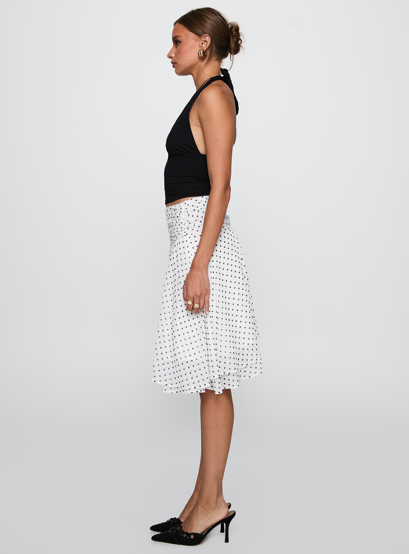   side view of model wearing Princess Polly Evanescence Asymmetrical Midi Skirt White / Polka Dot Midi Skirts 