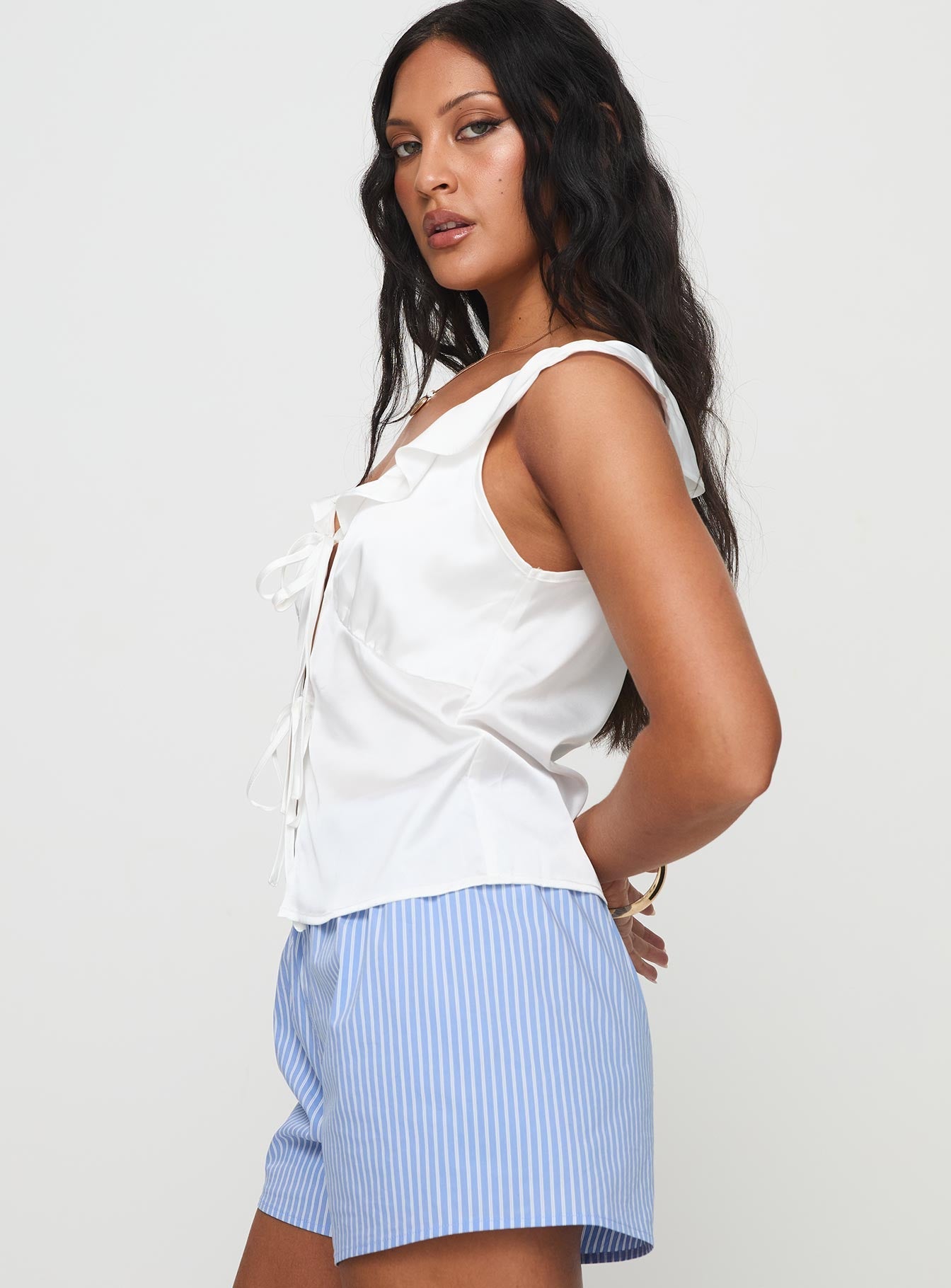 side view of model wearing Princess Polly Elsinthra Top White Short Sleeves V-Neck 